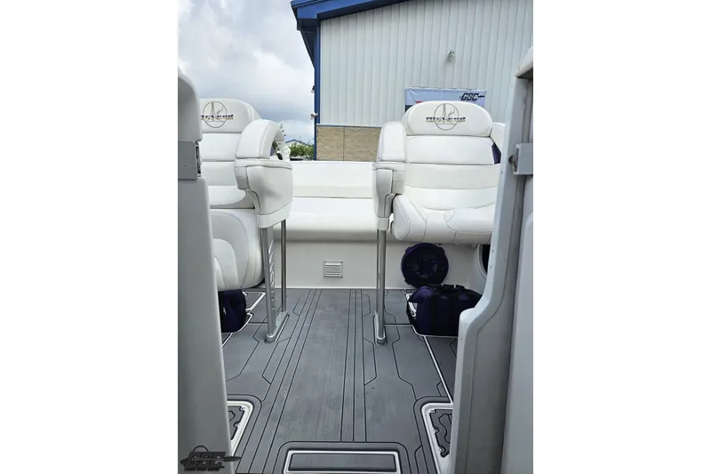 Slide: The Image of 2007 Sunsation 32 Dominator boat interior with white seating and sleek flooring. - 88