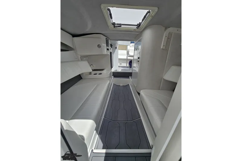 Slide: The Image of Interior of 2007 Sunsation 32 Dominator boat, featuring sleek white seating and modern design. - 87