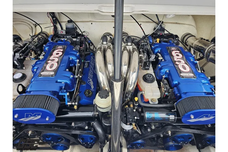 Slide: The Image of Twin Mercury Racing engines in a 2007 Sunsation 32 Dominator boat, showcasing high-performance power. - 99