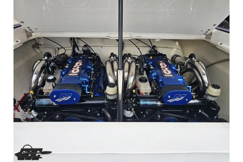 Slide: The Image of Twin engines in a 2007 Sunsation 32 Dominator boat, showcasing powerful performance. - 98