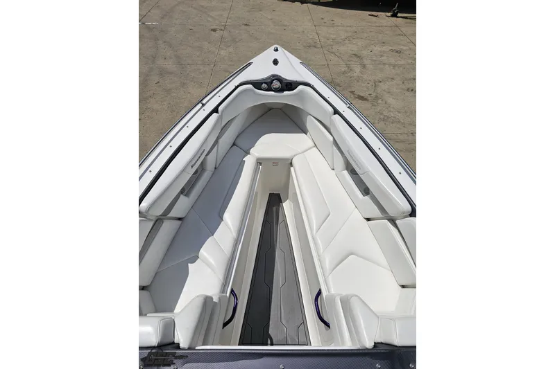 Slide: The Image of 2007 Sunsation 32 Dominator boat interior with white seating and sleek design. - 64