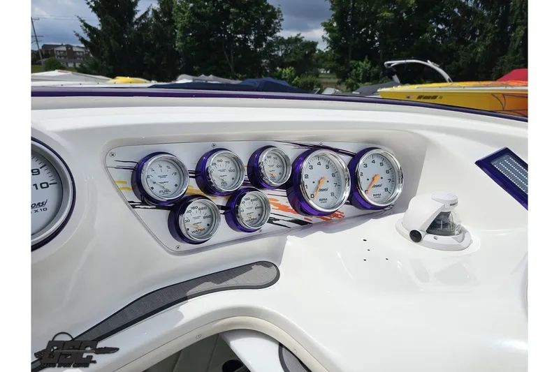 Slide: The Image of Dashboard of a 2007 Sunsation 32 Dominator boat with gauges and compass. - 52
