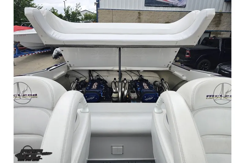 Slide: The Image of 2007 Sunsation 32 Dominator boat engine compartment with McLeod interior, showcasing twin Mercury engines. - 97