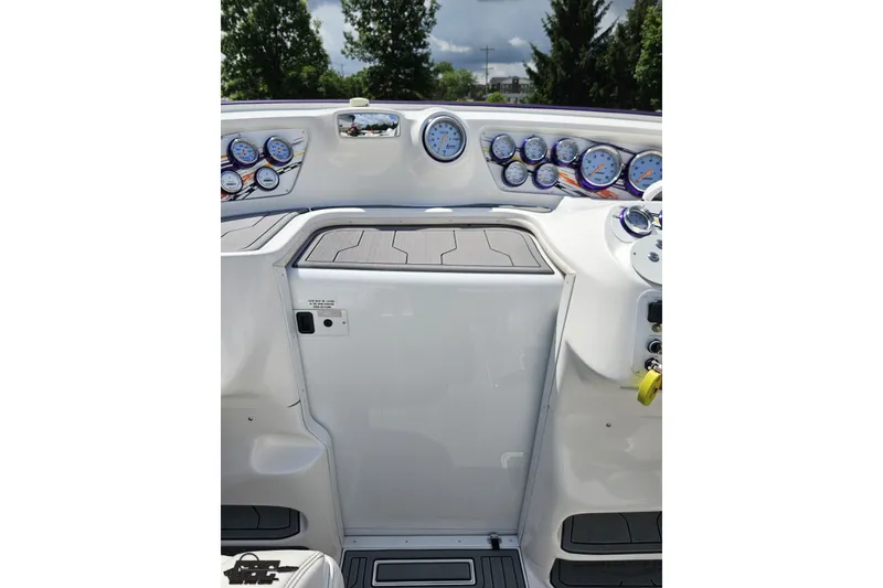 Slide: The Image of 2007 Sunsation 32 Dominator boat dashboard with multiple gauges and sleek design. - 66