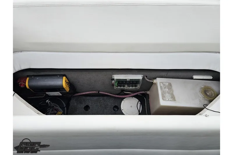 Slide: The Image of Storage compartment of a 2007 Sunsation 32 Dominator boat, featuring electrical components. - 94