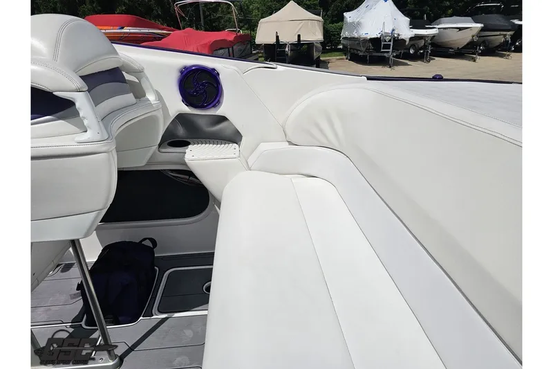 Slide: The Image of 2007 Sunsation 32 Dominator boat interior with white seating and speaker detail. - 44