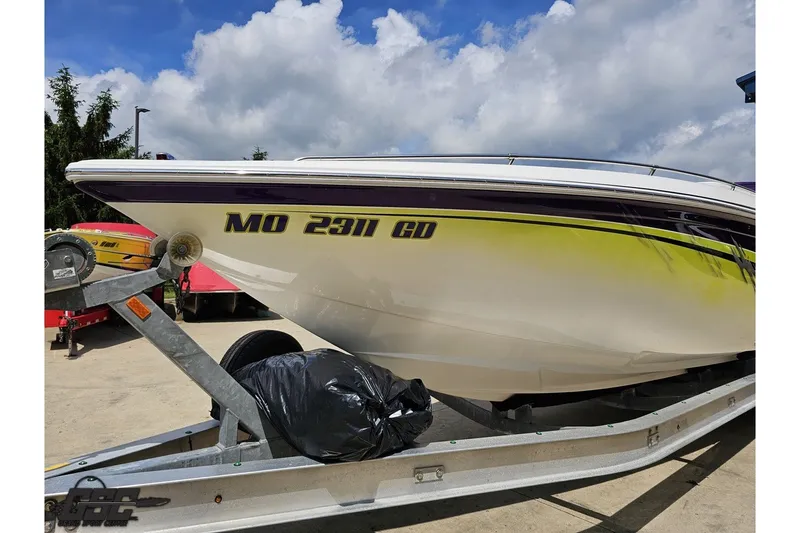 Slide: The Image of 2007 Sunsation 32 Dominator boat on trailer under cloudy sky. - 17