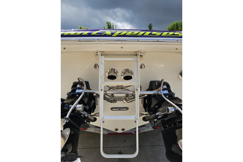 Slide: The Image of Rear view of 2007 Sunsation 32 Dominator boat with dual engines and ladder. - 32