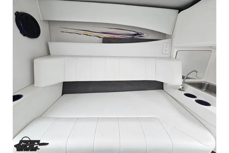 Slide: The Image of 2007 Sunsation 32 Dominator interior with white seating, sink, and cup holders. - 71