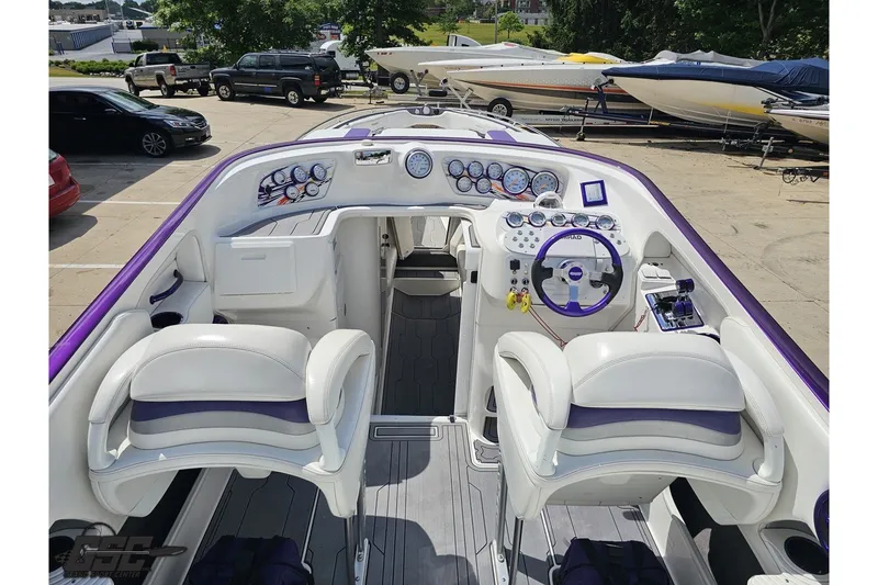 Slide: The Image of 2007 Sunsation 32 Dominator boat interior with dual seats and detailed dashboard controls. - 40