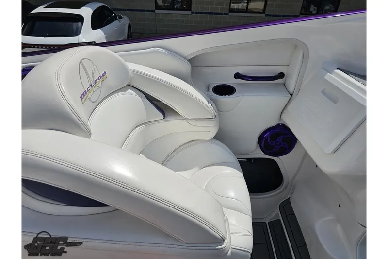 Slide: The Image of Luxurious white seating in a 2007 Sunsation 32 Dominator boat interior. - 48