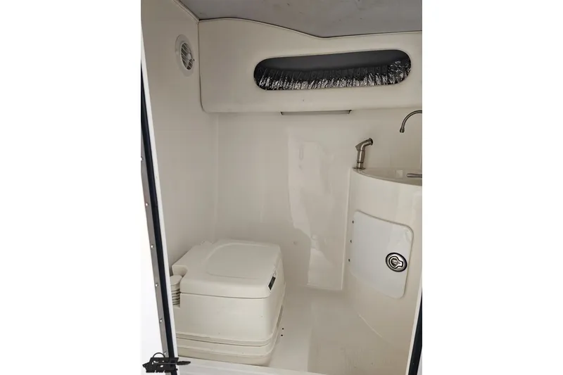 Slide: The Image of 2007 Sunsation 32 Dominator boat interior bathroom with toilet and sink. - 76