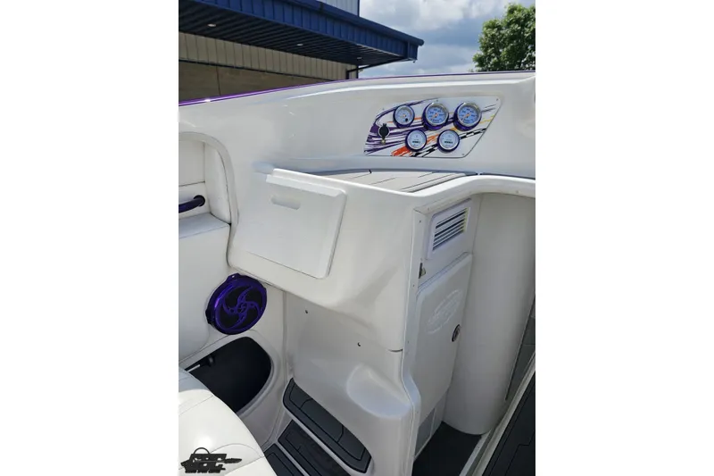 Slide: The Image of 2007 Sunsation 32 Dominator boat interior with dashboard and storage compartments. - 50