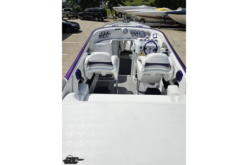 Slide: The Image of 2007 Sunsation 32 Dominator boat interior with white seating and control panel. - 37