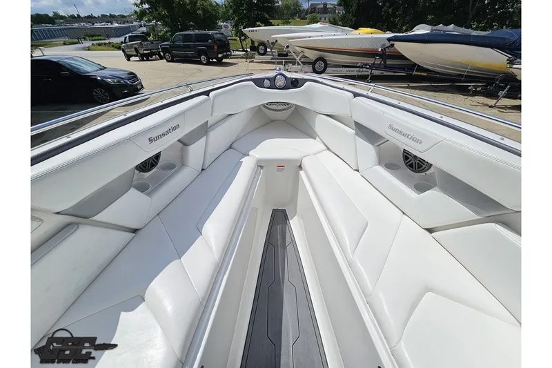 Slide: The Image of 2007 Sunsation 32 Dominator boat interior with white seating and sleek design. - 82