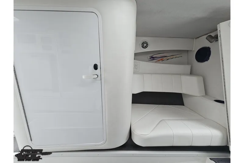 Slide: The Image of 2007 Sunsation 32 Dominator cabin interior with white seating and sleek design. - 75