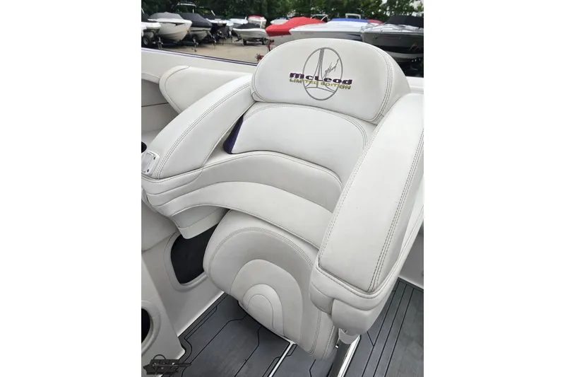 Slide: The Image of Luxurious white seating in a 2007 Sunsation 32 Dominator boat, featuring McLeod embroidery. - 90