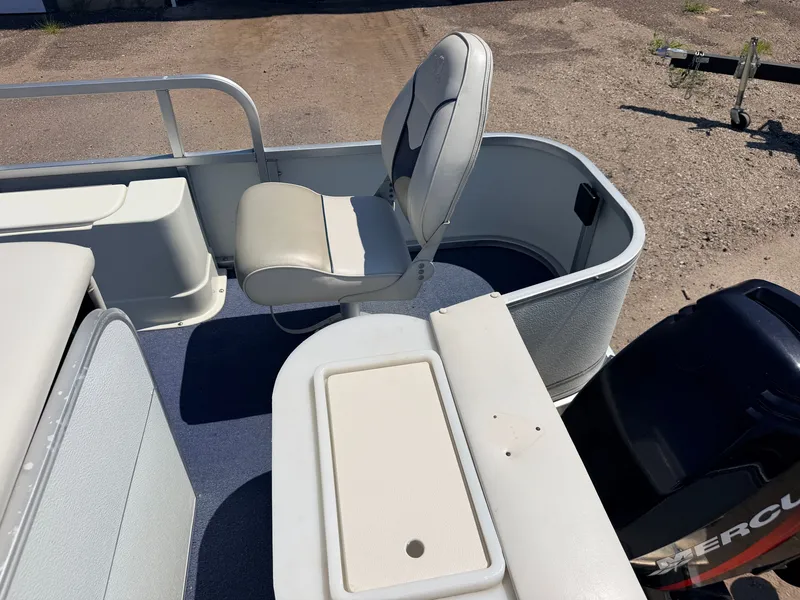 Slide: The Image of A 2004 Palm Beach model with a 50HP Mercury 4Stroke engine. It features white seats and a blue deck. - 39