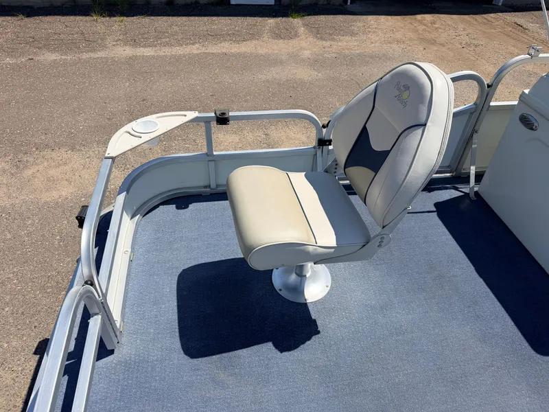 Slide: The Image of A swivel chair on a blue carpeted floor in a boat. - 15