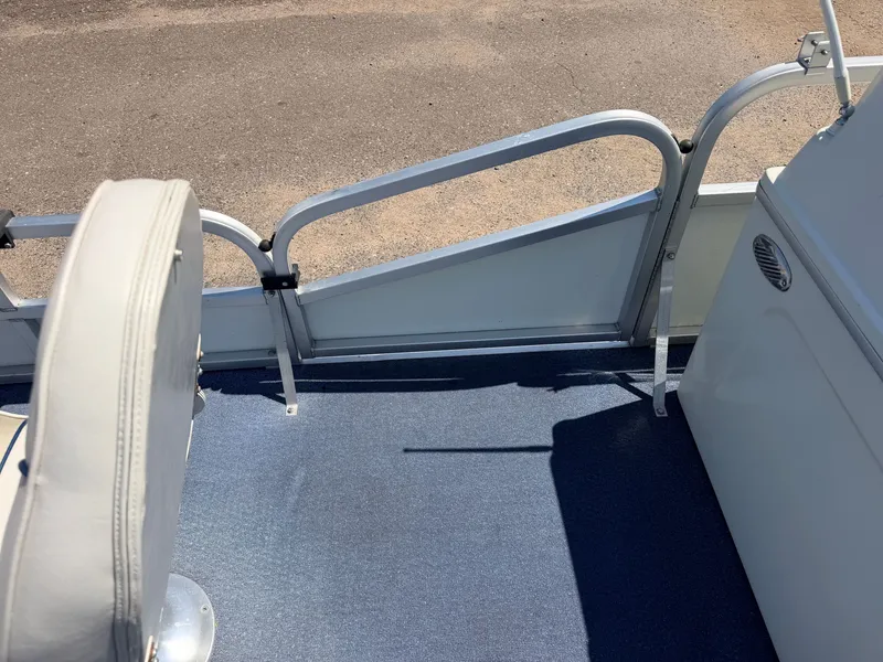 Slide: The Image of A section of a boat with blue flooring and white seating is visible. - 18