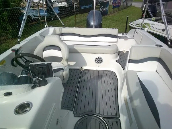 Slide: The Image of The image shows the cockpit of a 2019 Starcraft Allstar 1915 boat with gray seating and flooring. - 2