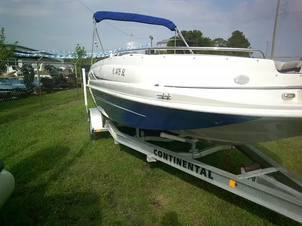 Slide: The Image of A 2019 Starcraft Allstar 1915 boat is on a trailer on a grassy area. - 7