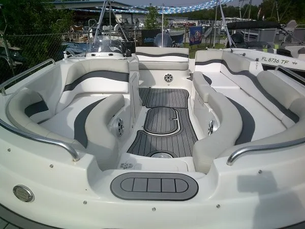 Slide: The Image of The image shows the spacious cockpit of a 2019 Starcraft Allstar 1915 boat with gray and white seating. - 9