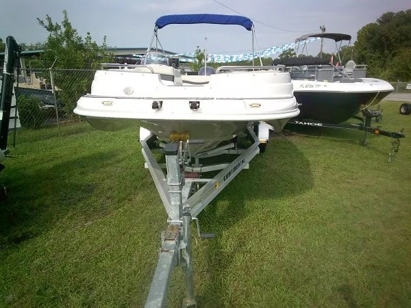 Slide: The Image of A white 2019 Starcraft Allstar 1915 boat on a trailer, parked on grass. - 10