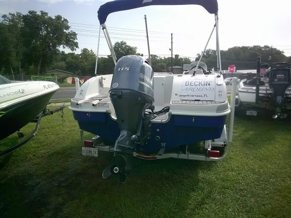 Slide: The Image of 2019 Starcraft Allstar 1915 with outboard motor, parked on grass. - 5