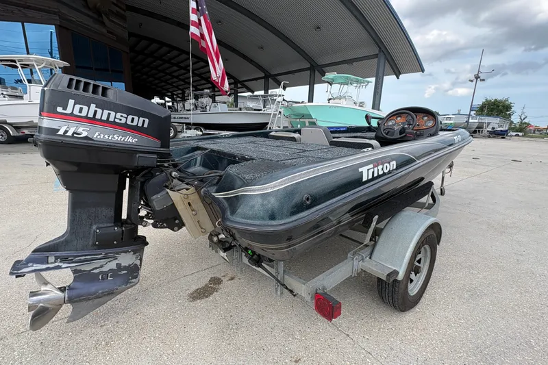 Slide: The Image of 1998 Triton Tr-17 boat with Johnson 115 FastStrike engine on trailer. - 3