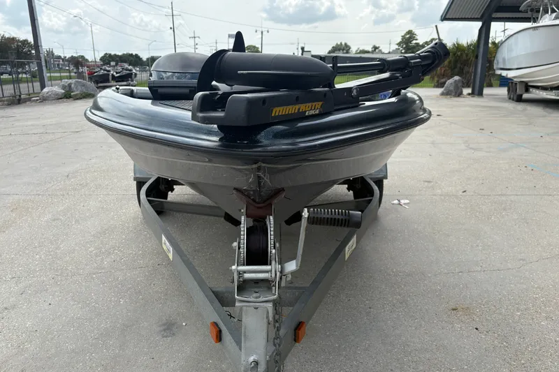 Slide: The Image of 1998 Triton Tr-17 boat on trailer, featuring Minn Kota Edge trolling motor. - 8