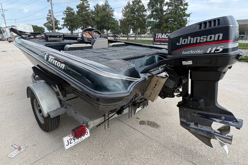 Slide: The Image of 1998 Triton Tr-17 boat with Johnson FastStrike 115 engine on a trailer. - 5