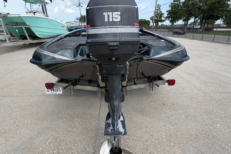 Slide: The Image of 1998 Triton Tr-17 boat with 115 FastStrike motor on trailer. - 4