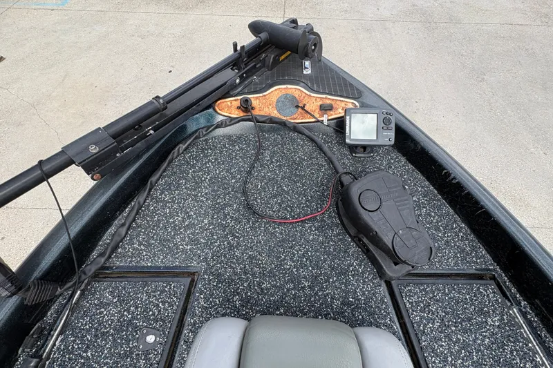 Slide: The Image of 1998 Triton Tr-17 boat deck with trolling motor and fish finder. - 16