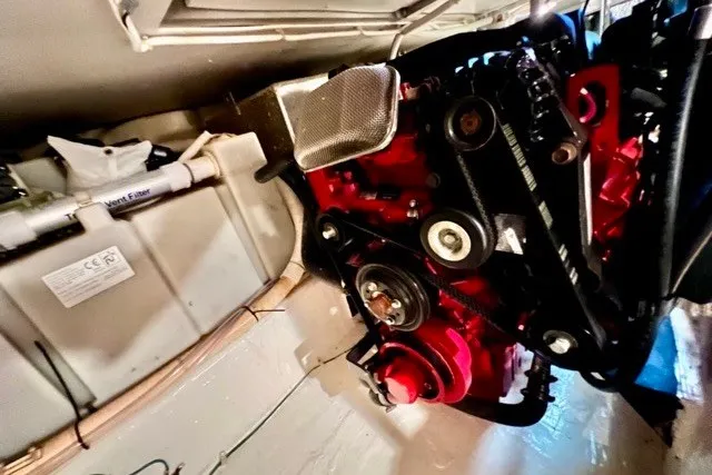 Slide: The Image of Engine compartment of a 2004 Carver 420 Mariner, showcasing mechanical components and details. - 40