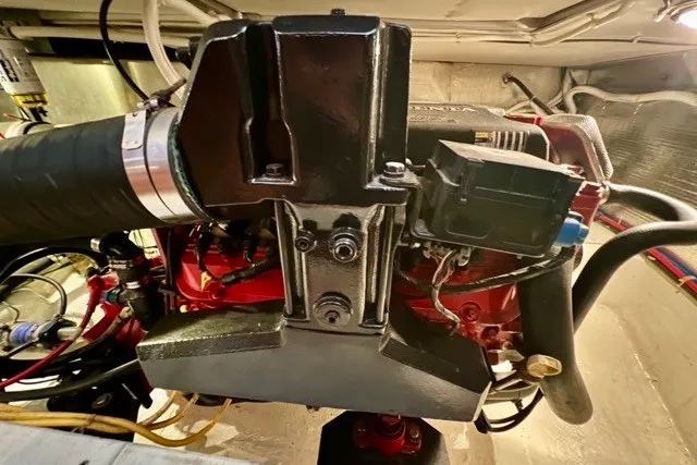 Slide: The Image of Engine compartment of a 2004 Carver 420 Mariner boat, showcasing mechanical components. - 42
