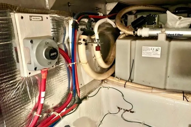 Slide: The Image of Engine room of a 2004 Carver 420 Mariner with wiring and ventilation system. - 36