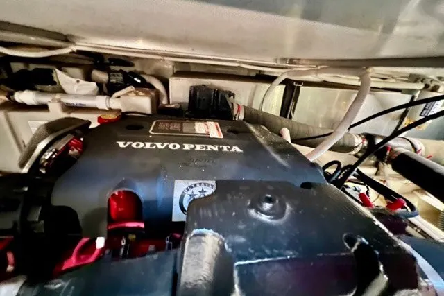 Slide: The Image of Engine compartment of a 2004 Carver 420 Mariner featuring a Volvo Penta engine. - 39