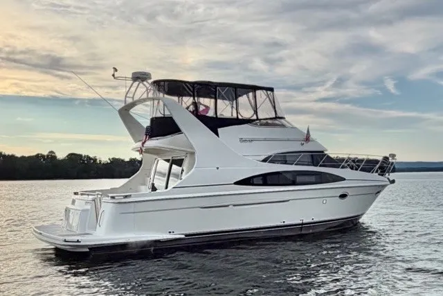 The Image of 2004 Carver 420 Mariner yacht on calm water at sunset. - 0