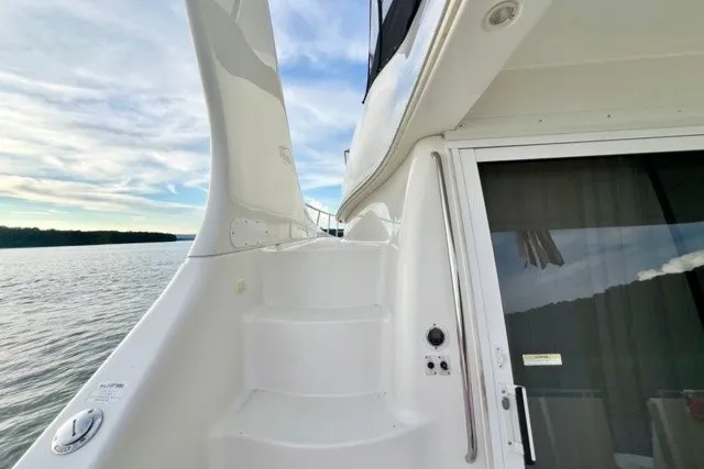 Slide: The Image of Stairway on 2004 Carver 420 Mariner yacht, leading to upper deck with scenic water view. - 7