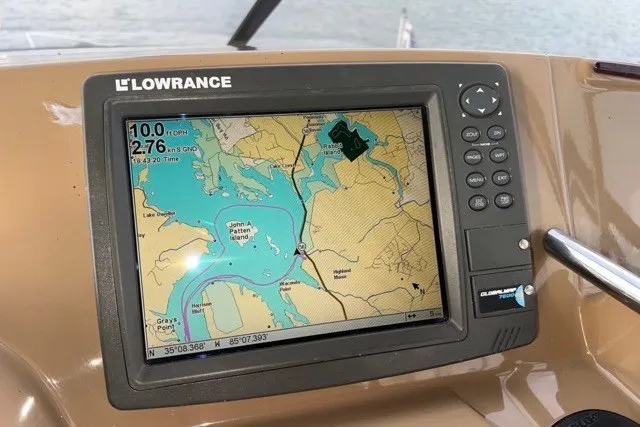 Slide: The Image of Lowrance GPS navigation system on 2004 Carver 420 Mariner, displaying a detailed marine map. - 17