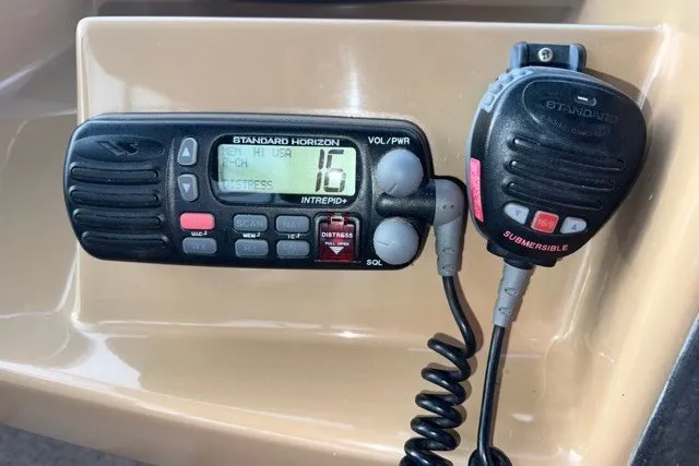 Slide: The Image of Standard Horizon marine radio on a 2004 Carver 420 Mariner boat dashboard. - 15