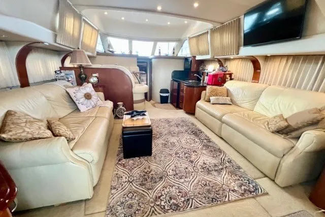 Slide: The Image of Luxurious interior of a 2004 Carver 420 Mariner yacht with elegant seating and decor. - 19