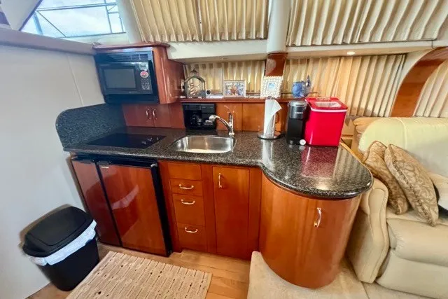 Slide: The Image of Luxurious kitchen interior of 2004 Carver 420 Mariner yacht with modern amenities. - 20