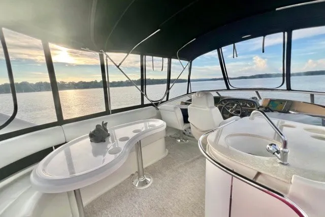 Slide: The Image of Luxurious interior of 2004 Carver 420 Mariner yacht with scenic water view. - 8