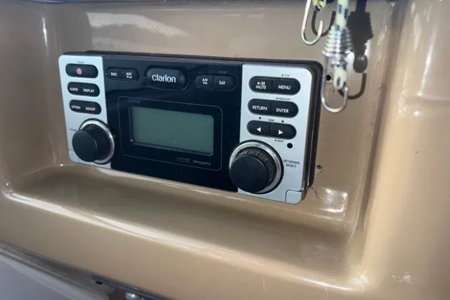 Slide: The Image of Clarion stereo system on 2004 Carver 420 Mariner boat dashboard. - 14