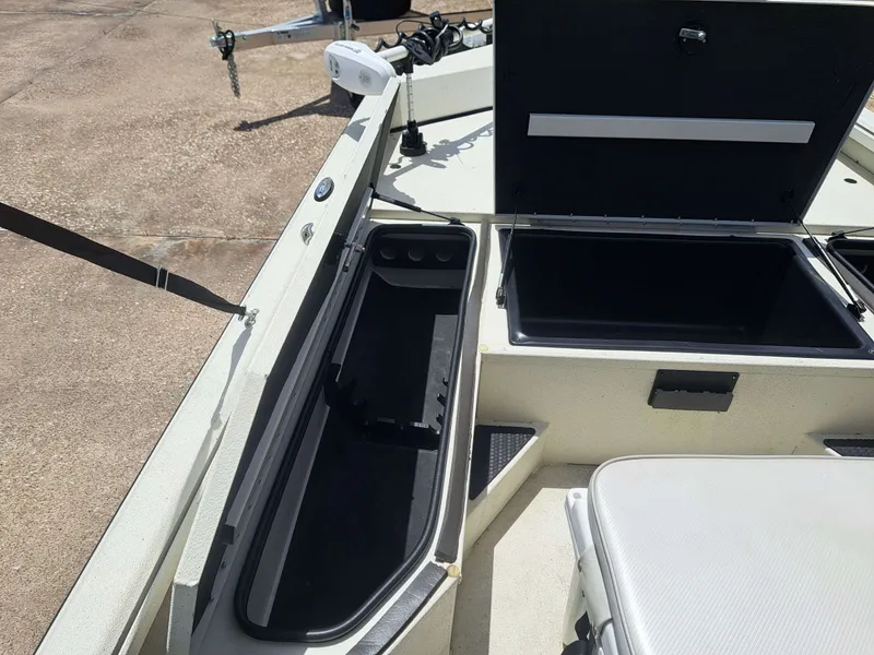 Slide: The Image of The image shows the deck of a 2022 Ranger RB190 boat with storage compartments and seating area. - 15