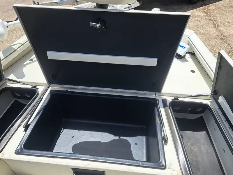 Slide: The Image of The image shows an open storage compartment on a 2022 Ranger RB190 boat. - 17