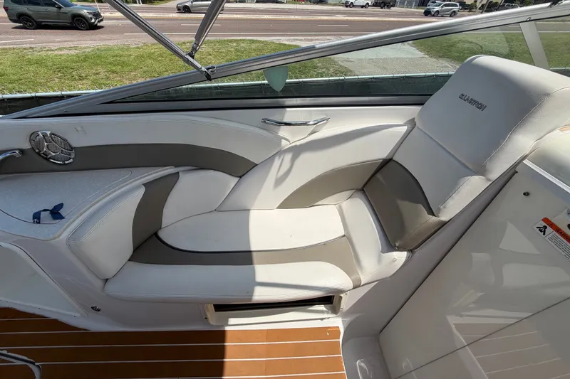 Slide: The Image of 2016 Glastron GS 259 boat interior with white and gray seating, showcasing modern design. - 25