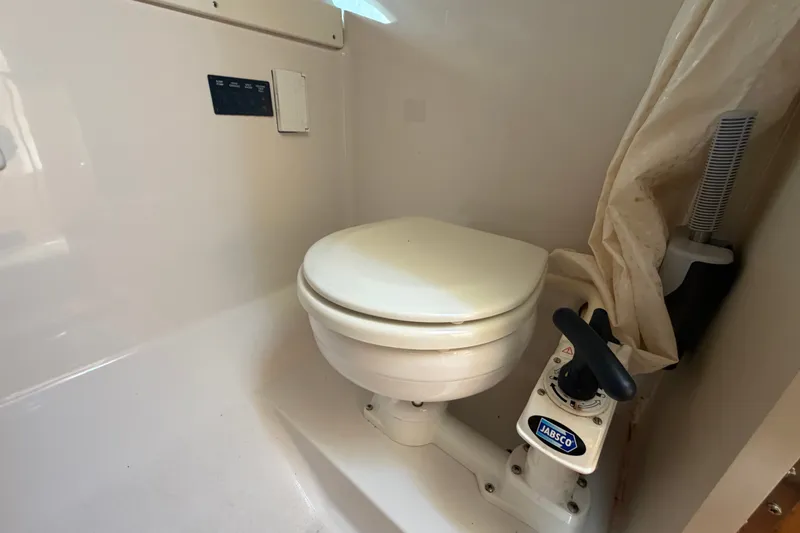 Slide: The Image of 2016 Glastron GS 259 boat bathroom with Jabsco marine toilet. - 67